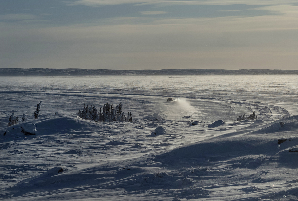 A light vehicle on a section of the Gahcho Kué Mine winter spur road