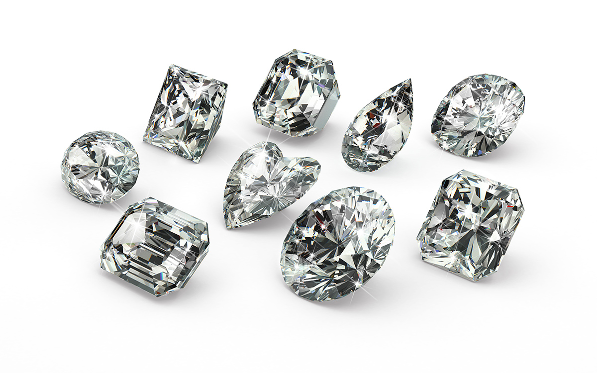9 colorless diamonds of different cuts and shapes: round cuts, emerald cut, radiant cuts, pear shaped, and more. 
