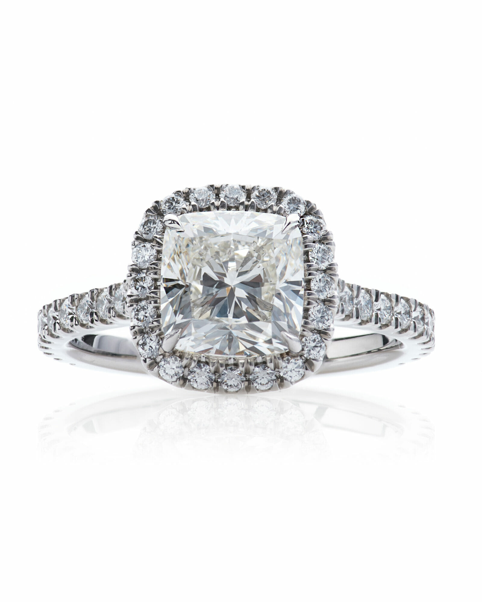 Center Stone Cushion Cut Halo Engagement Ring in Platinum