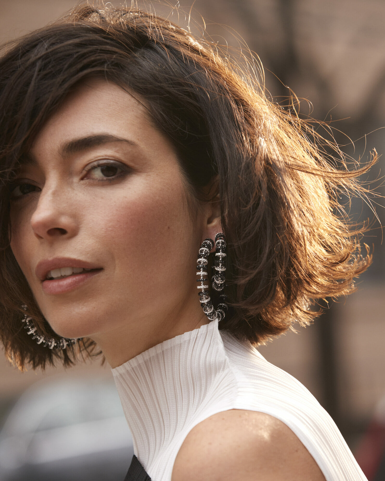 New hoops, woman wearing black an white diamond hoop earrings