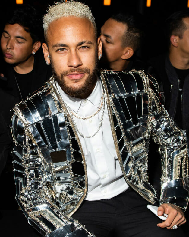 Soccer player Neymar wearing diamond jewelry during the Fashion week stylish athletes
