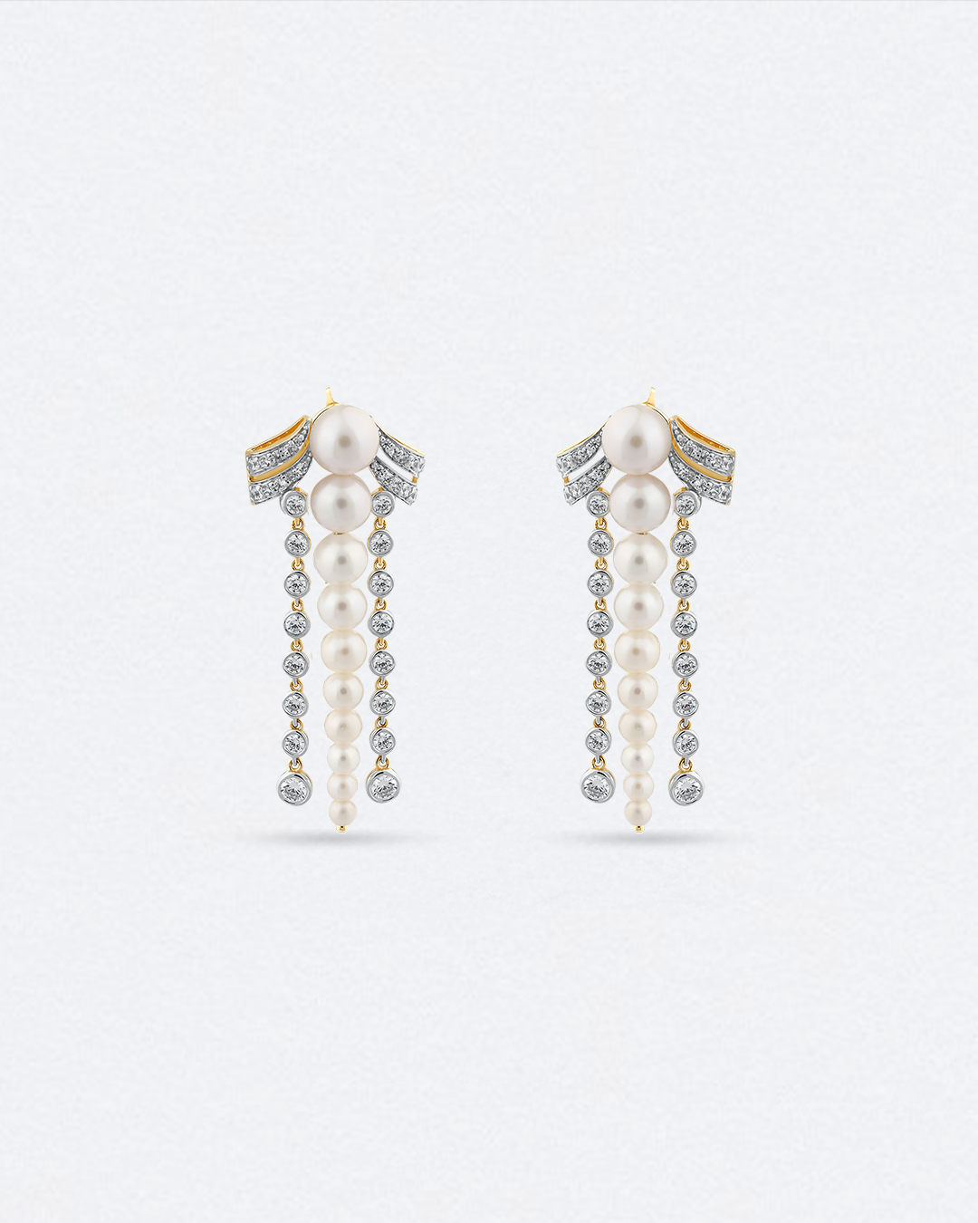 Elegant bow-shaped earrings with diamond strands and pearls