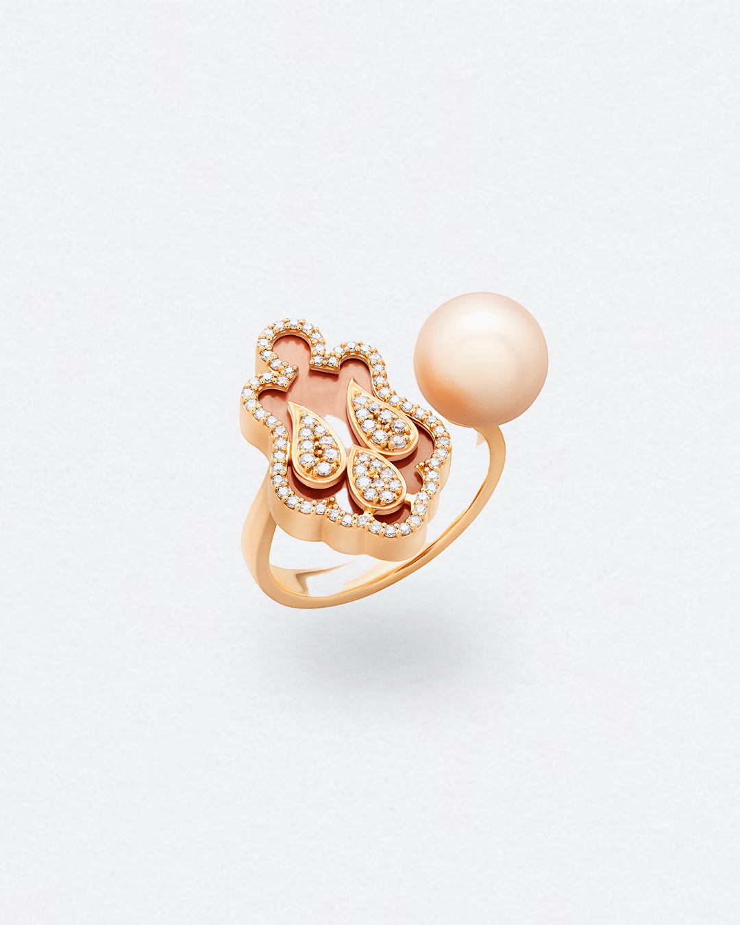 Rose gold ring with diamonds and pearl